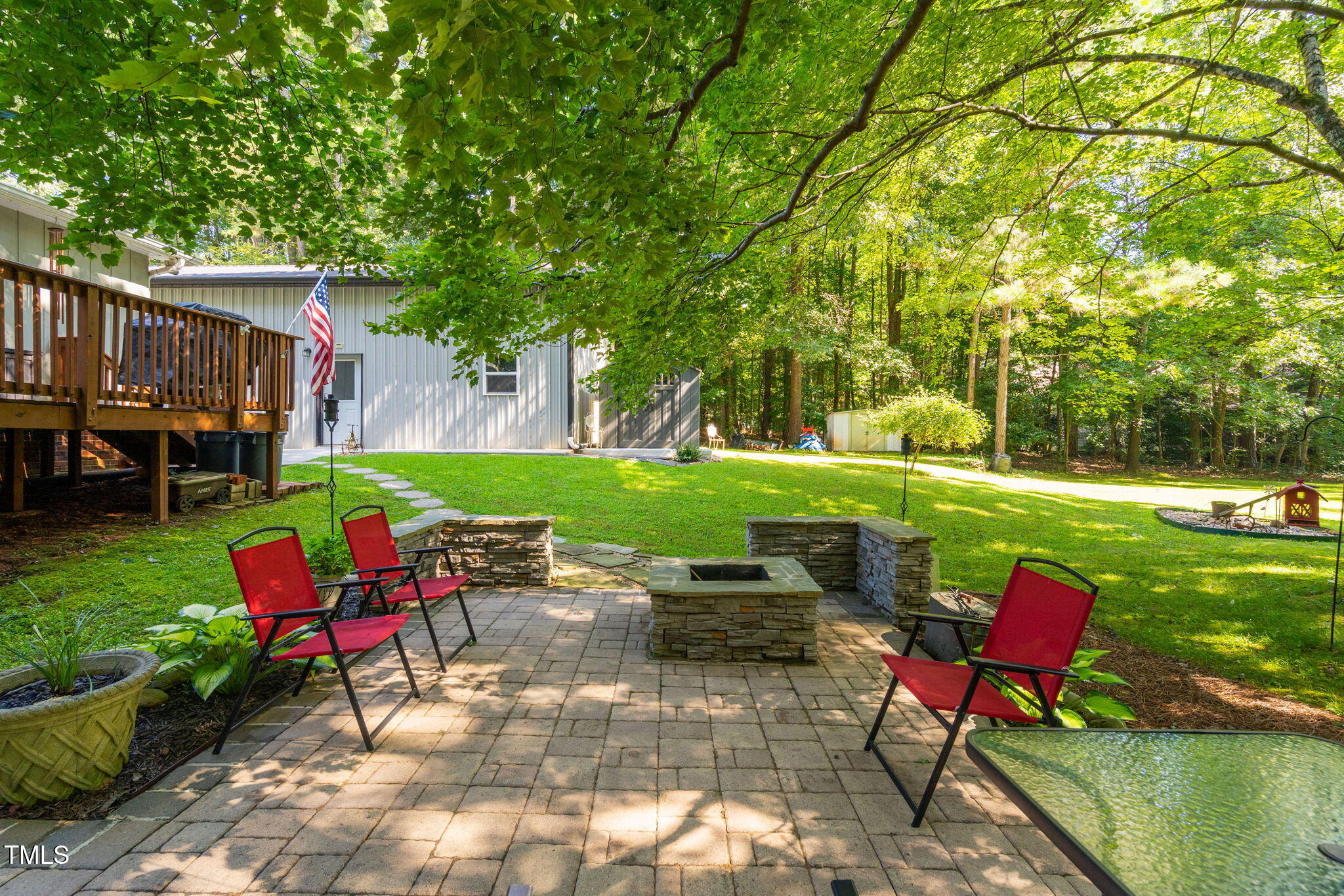 8236 Jackson Road Wake Forest, NC 27587 - Photo 40 of 74 a view of a table and chairs in the garden