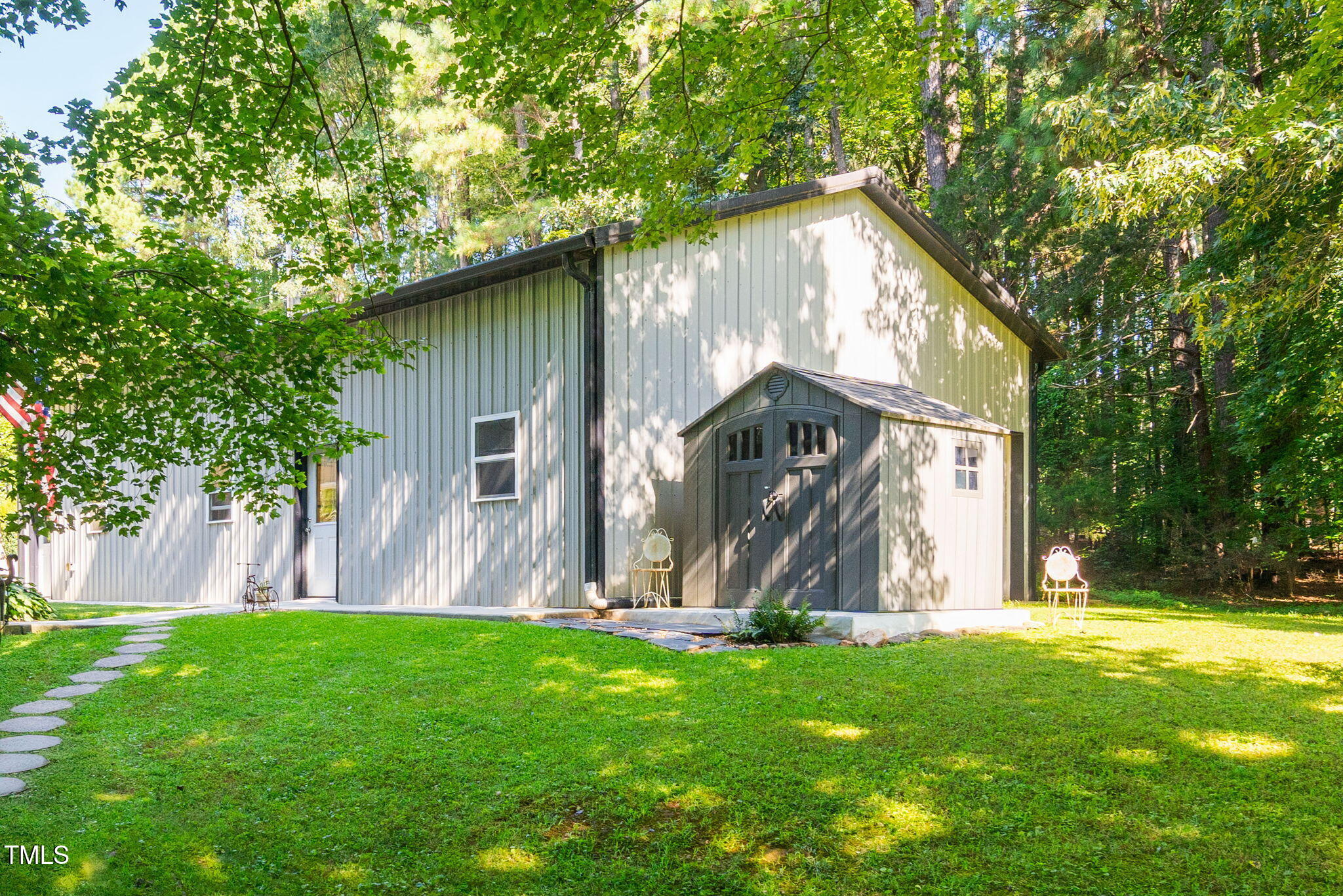 8236 Jackson Road Wake Forest, NC 27587 - Photo 45 of 74 a view of a house with a tree and a yard