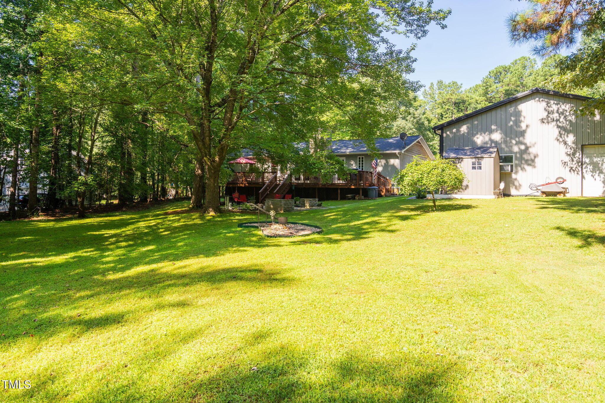 8236 Jackson Road Wake Forest, NC 27587 - Photo 56 of 74 a view of a house with a yard and a large tree