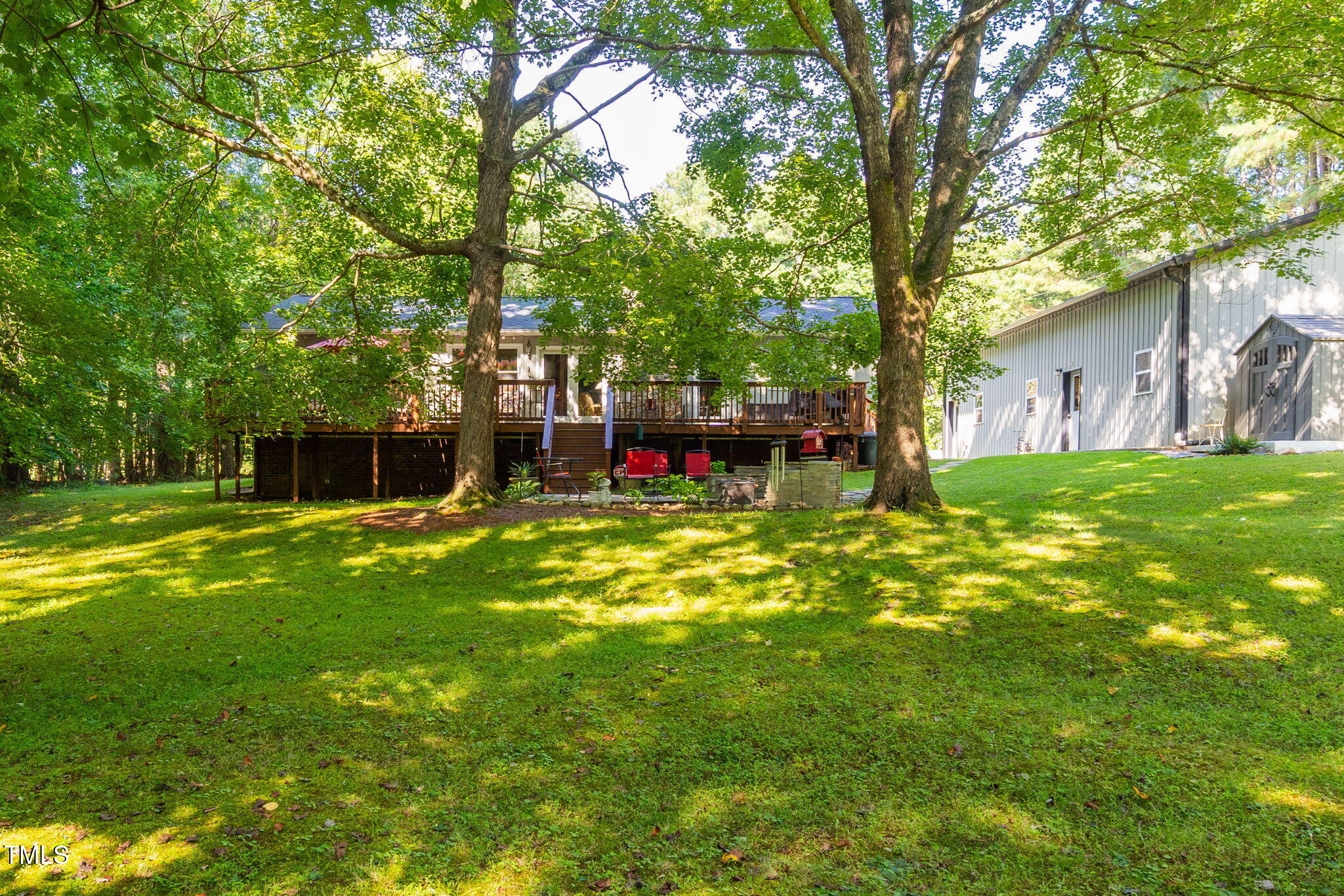 8236 Jackson Road Wake Forest, NC 27587 - Photo 60 of 74 a view of a house with a big yard and large tree