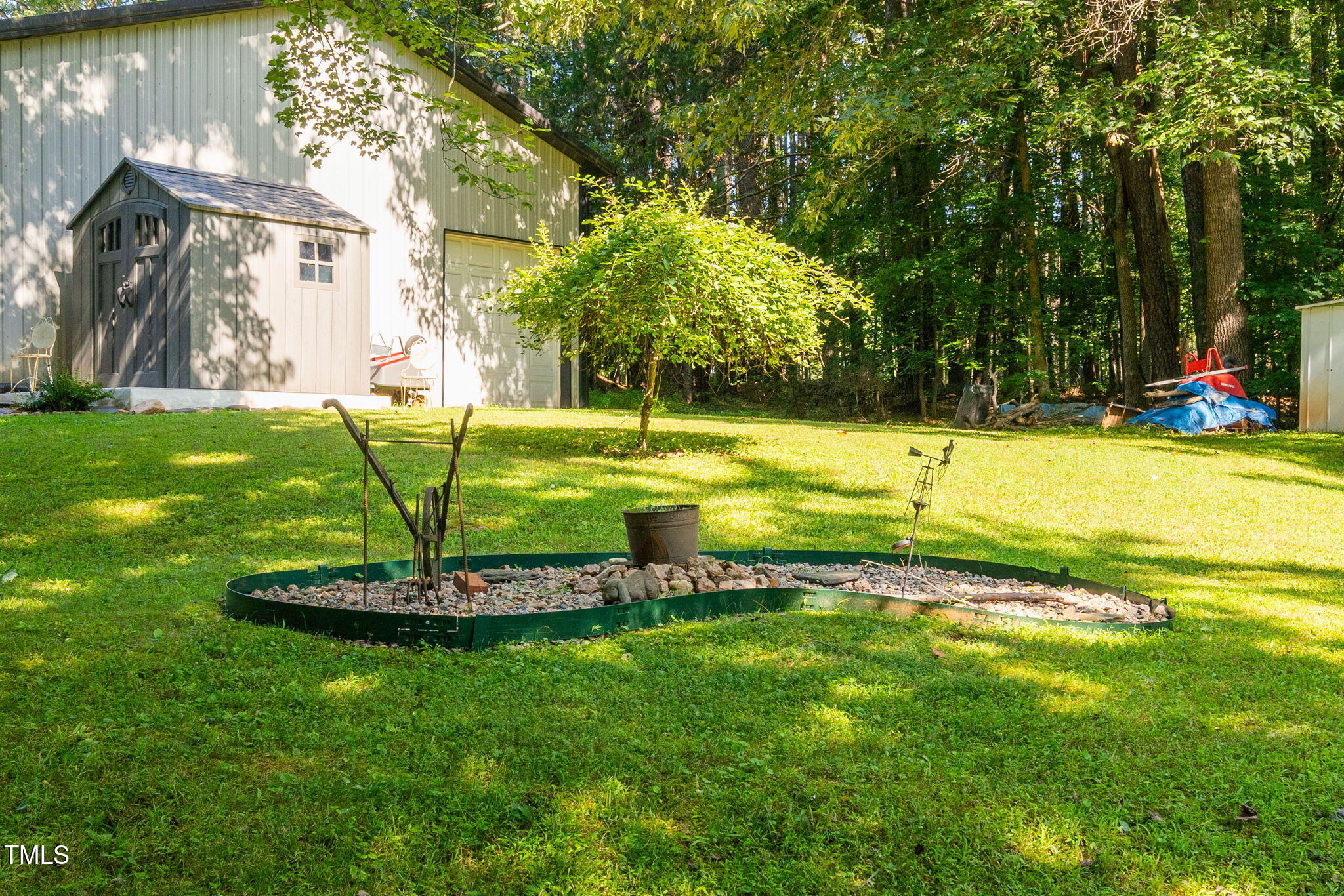 8236 Jackson Road Wake Forest, NC 27587 - Photo 63 of 74 a view of a swimming pool with a yard and palm trees