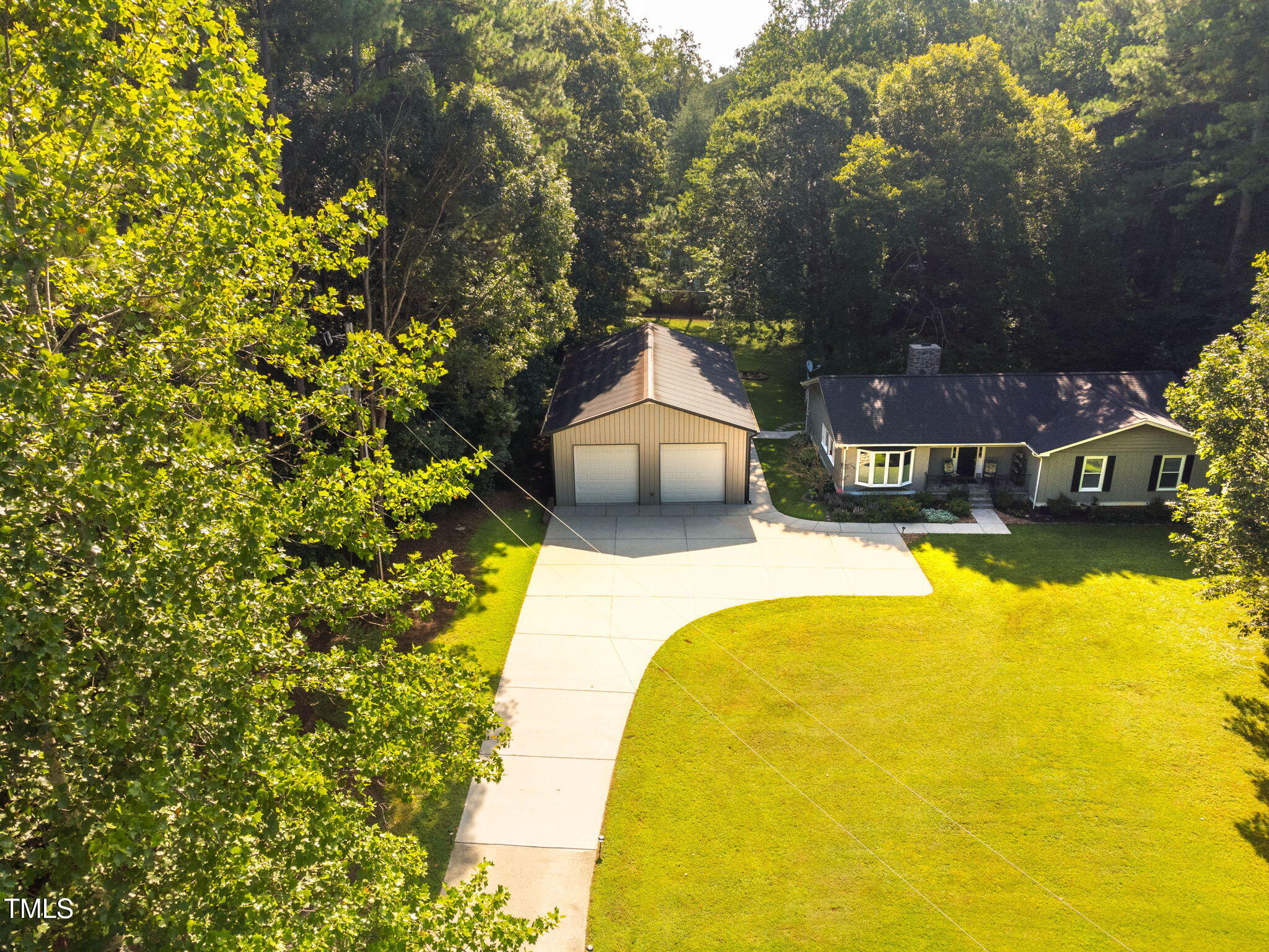 8236 Jackson Road Wake Forest, NC 27587 - Photo 65 of 74 a swimming pool with some trees in the background