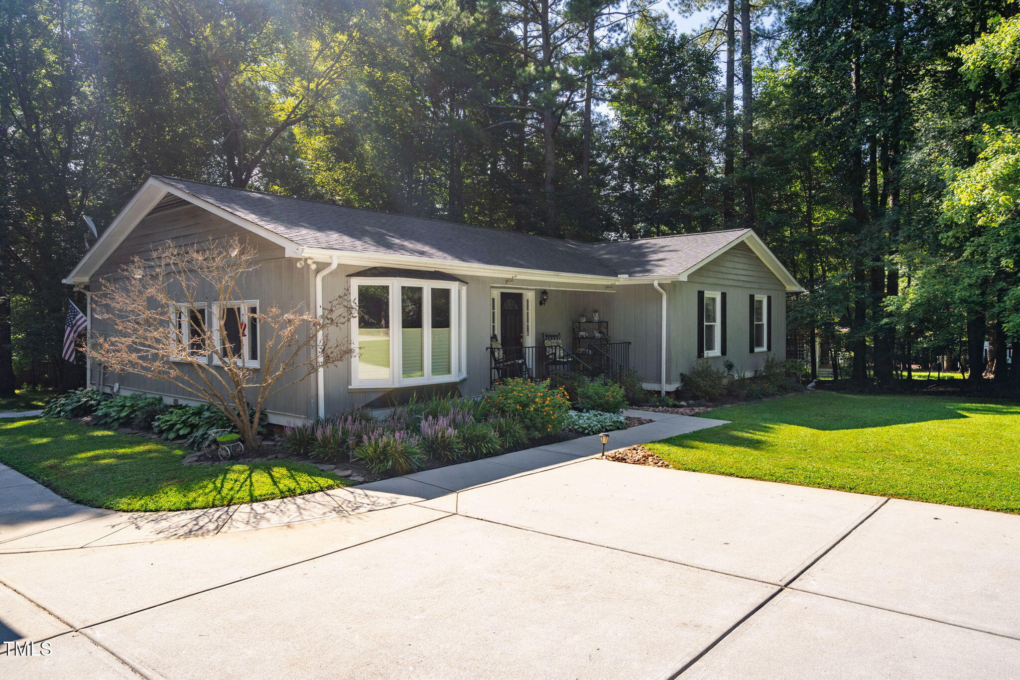 8236 Jackson Road Wake Forest, NC 27587 - Photo 72 of 74 a front view of a house with a yard and trees