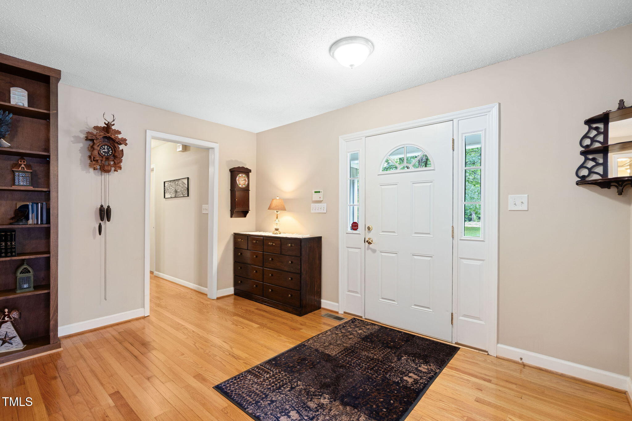 8236 Jackson Road Wake Forest, NC 27587 - Photo 8 of 74 a bedroom with a bed and a dresser