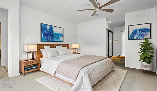 a bedroom with bed and furniture