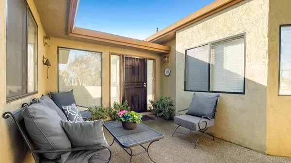 a outdoor living space with furniture and a potted plant