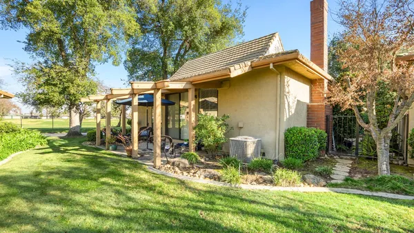 a view of backyard with a garden and plants