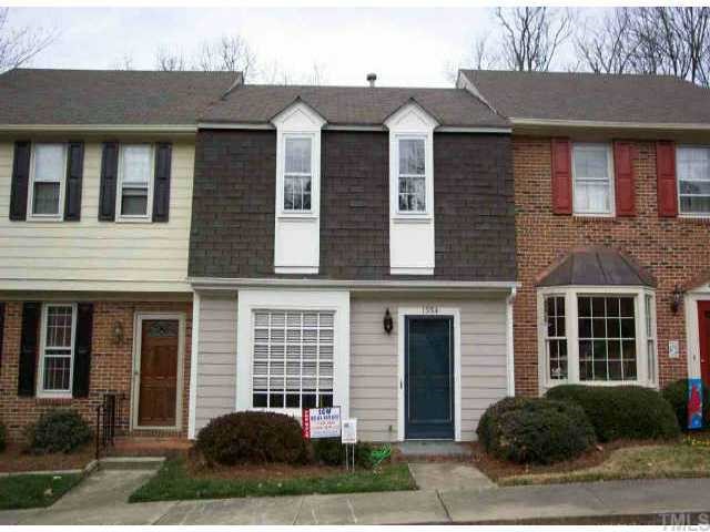 1334 Dylan Heath Court Raleigh, NC 27608 - Photo 1 of 1 a front view of a house with a yard