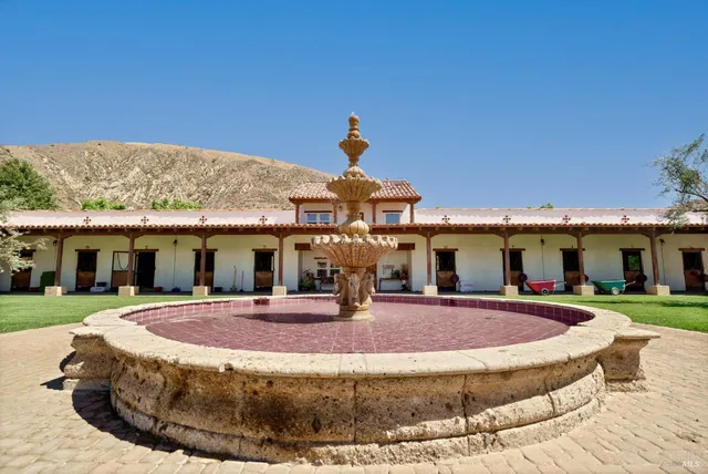 a view of a house with swimming pool and porch