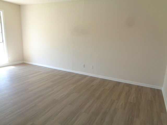 620 Grantham Road Baytown, TX 77521 - Photo 14 of 17 a view of an empty room with wooden floor