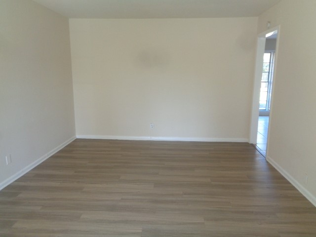 620 Grantham Road Baytown, TX 77521 - Photo 15 of 17 a view of an empty room and wooden floor