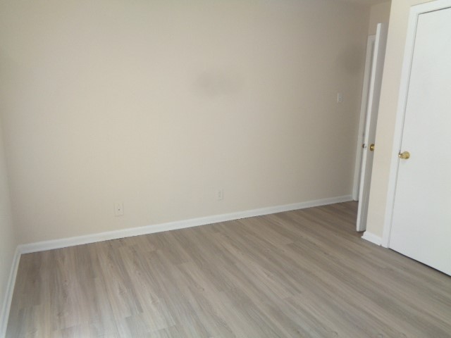 620 Grantham Road Baytown, TX 77521 - Photo 5 of 17 a view of an empty room with wooden floor