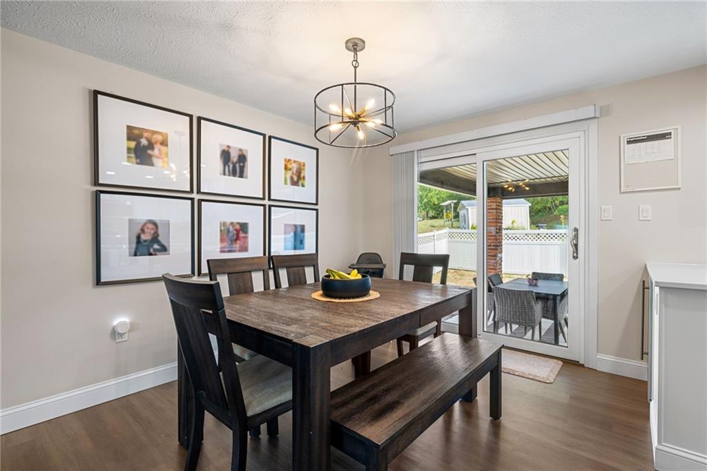 75 Fawnvue Drive McKees Rocks, PA 15136 - Photo 11 of 46 a view of a dining room with furniture window and wooden floor