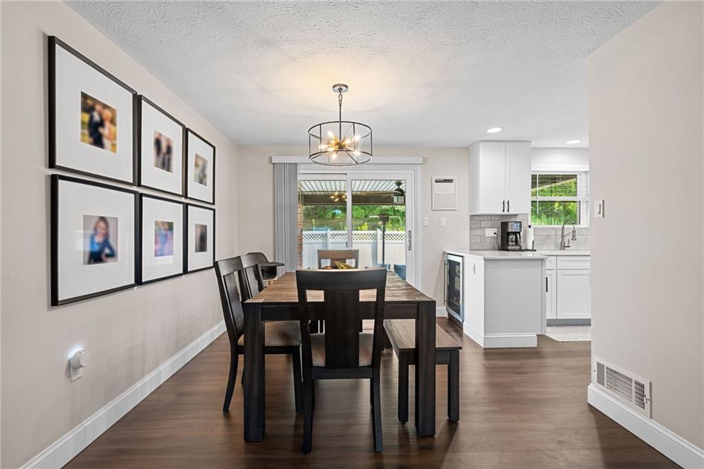 75 Fawnvue Drive McKees Rocks, PA 15136 - Photo 12 of 46 a view of a dining room with furniture window and wooden floor