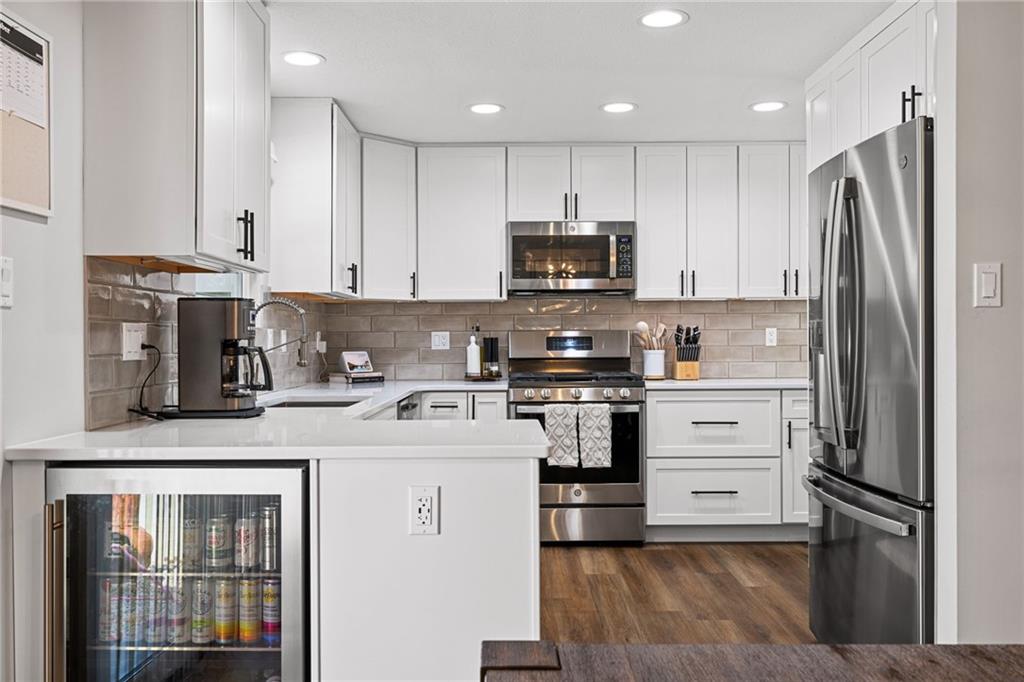 75 Fawnvue Drive McKees Rocks, PA 15136 - Photo 15 of 46 a kitchen with stainless steel appliances granite countertop a refrigerator sink stove microwave and cabinets