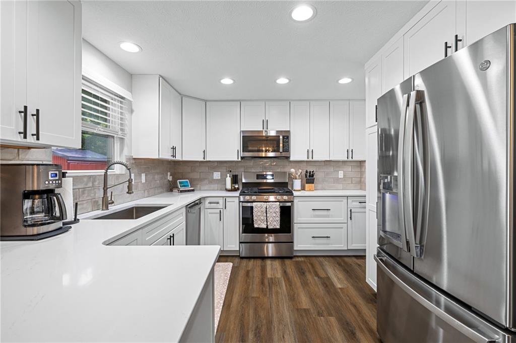 75 Fawnvue Drive McKees Rocks, PA 15136 - Photo 16 of 46 a kitchen with granite countertop a refrigerator and a sink
