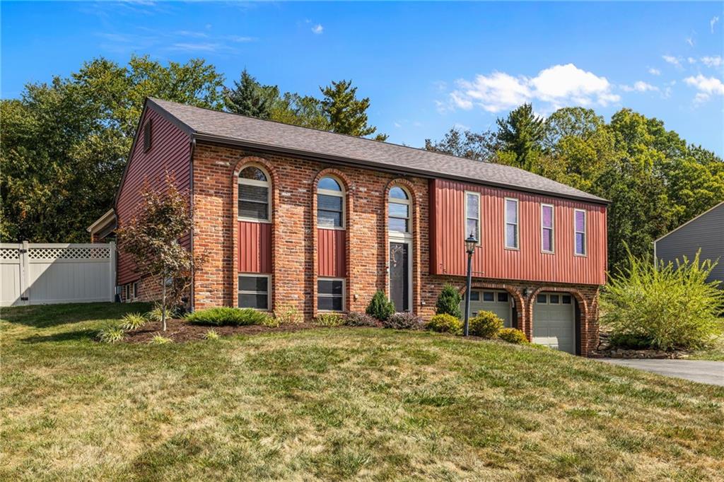 75 Fawnvue Drive McKees Rocks, PA 15136 - Photo 2 of 46 a front view of a house with a yard