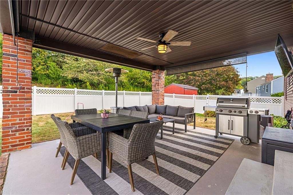 75 Fawnvue Drive McKees Rocks, PA 15136 - Photo 21 of 46 a view of a patio with table and chairs and wooden floor
