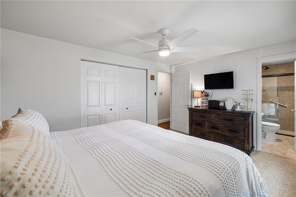 75 Fawnvue Drive McKees Rocks, PA 15136 - Photo 24 of 46 a bedroom with a bed and a flat tv screen on dresser