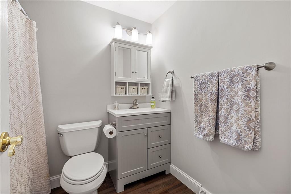 75 Fawnvue Drive McKees Rocks, PA 15136 - Photo 28 of 46 a bathroom with a toilet sink vanity and mirror