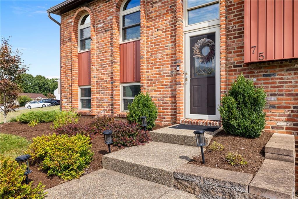75 Fawnvue Drive McKees Rocks, PA 15136 - Photo 4 of 46 a front view of a house with garden