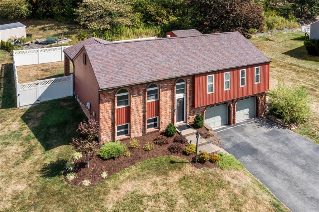 75 Fawnvue Drive McKees Rocks, PA 15136 - Photo 45 of 46 a backyard of a house with yard and outdoor seating