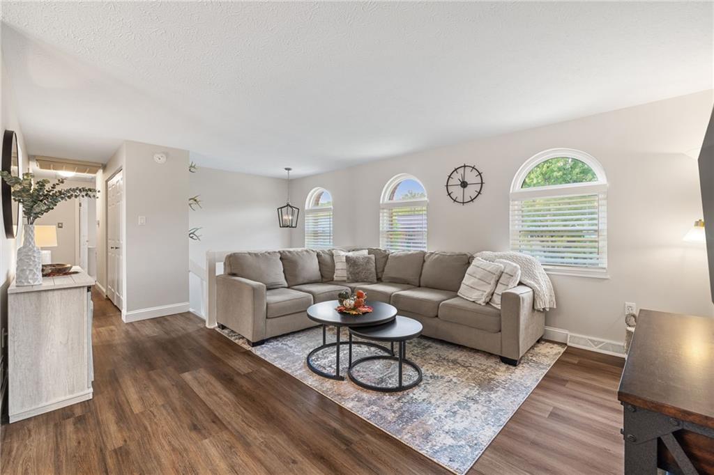75 Fawnvue Drive McKees Rocks, PA 15136 - Photo 8 of 46 a living room with furniture fireplace and wooden floor