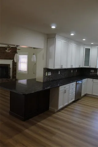 a view of a kitchen counter top space and stainless steel appliances