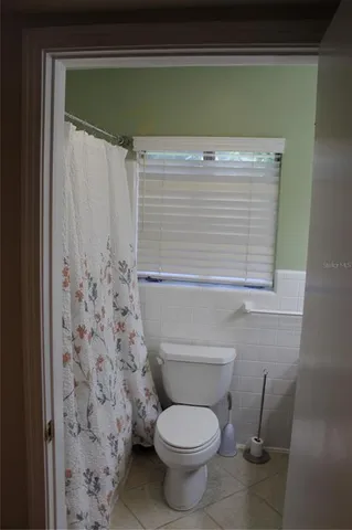 a bathroom with a toilet and a sink