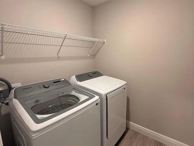 a utility room with dryer and washer