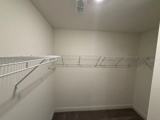 a view of a room with racks on the wall