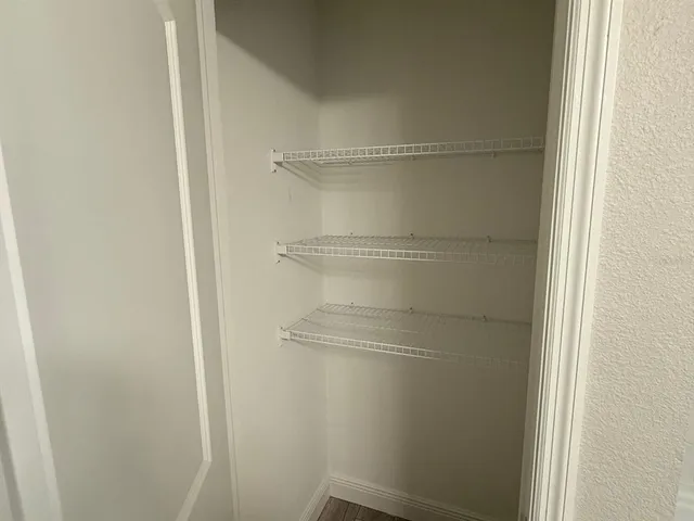 a empty closet with white paint