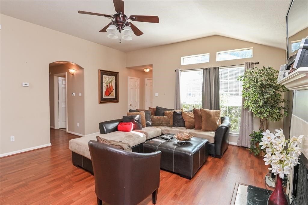 18446 South Wimbledon Drive Katy, TX 77449 - Photo 6 of 24 a living room with furniture and a potted plant