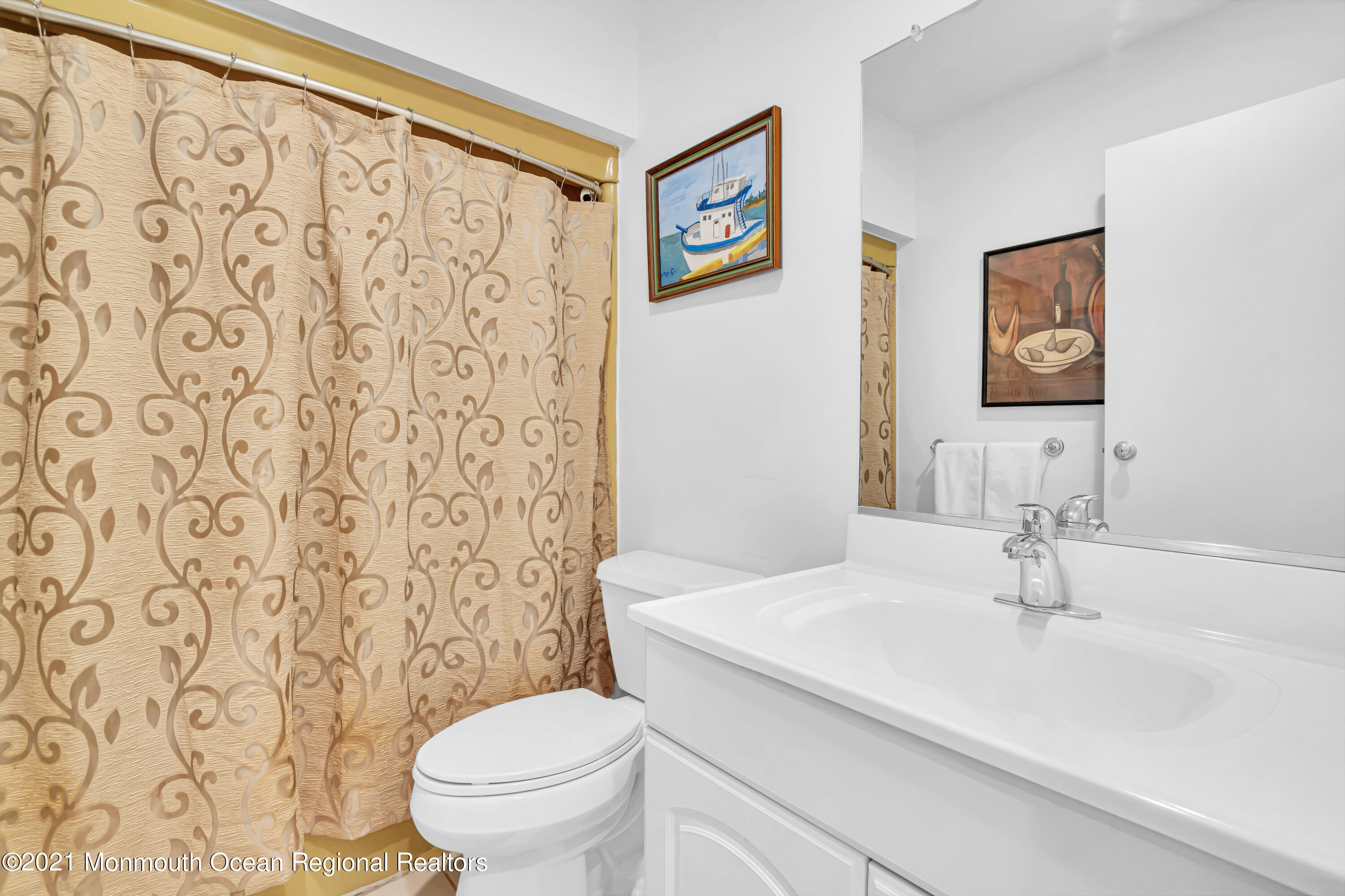 27 Locust Way Spring Lake Heights, NJ 07762 - Photo 22 of 43 a bathroom with a sink a toilet and a mirror