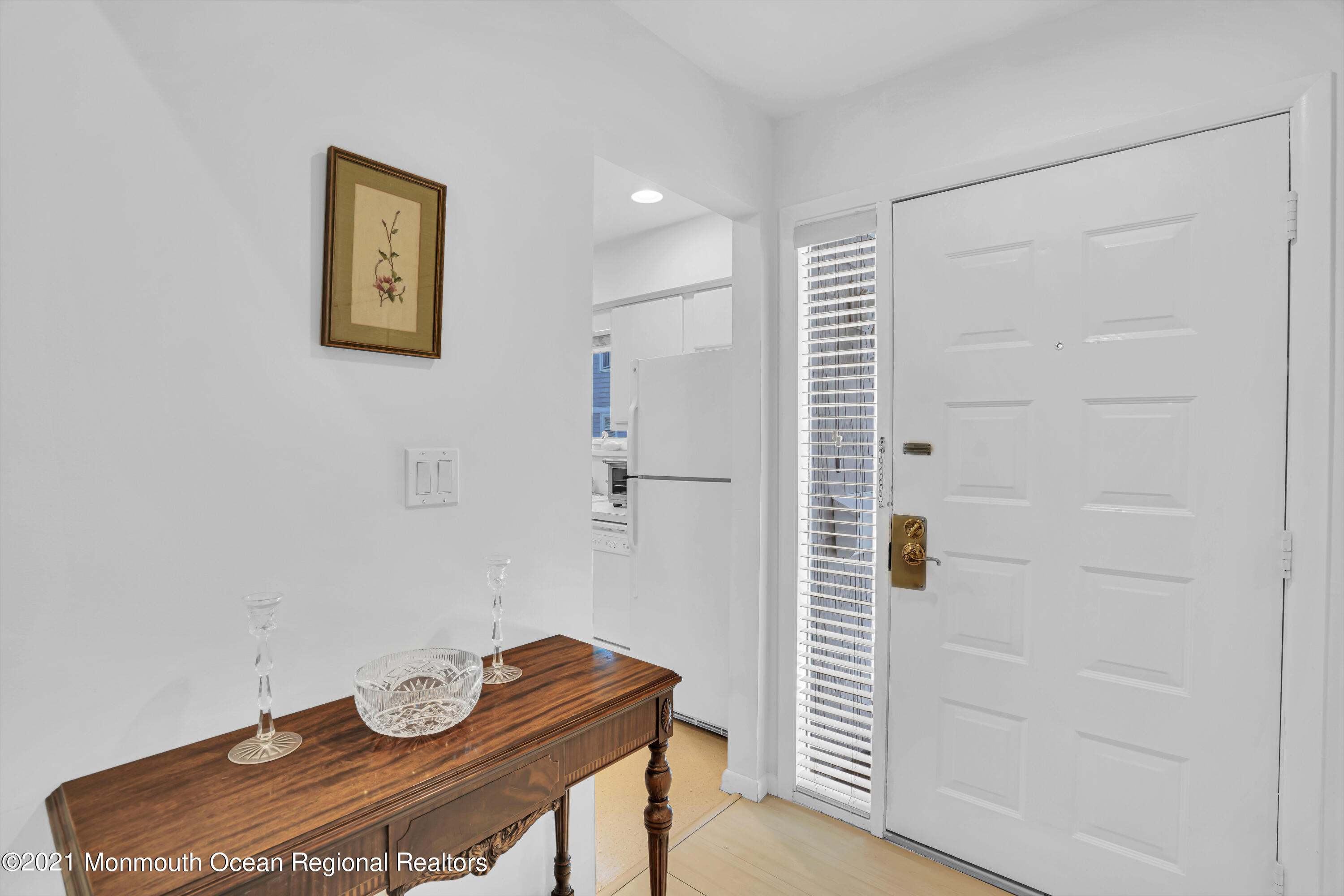 27 Locust Way Spring Lake Heights, NJ 07762 - Photo 4 of 43 a view of a hallway with paintings on the wall