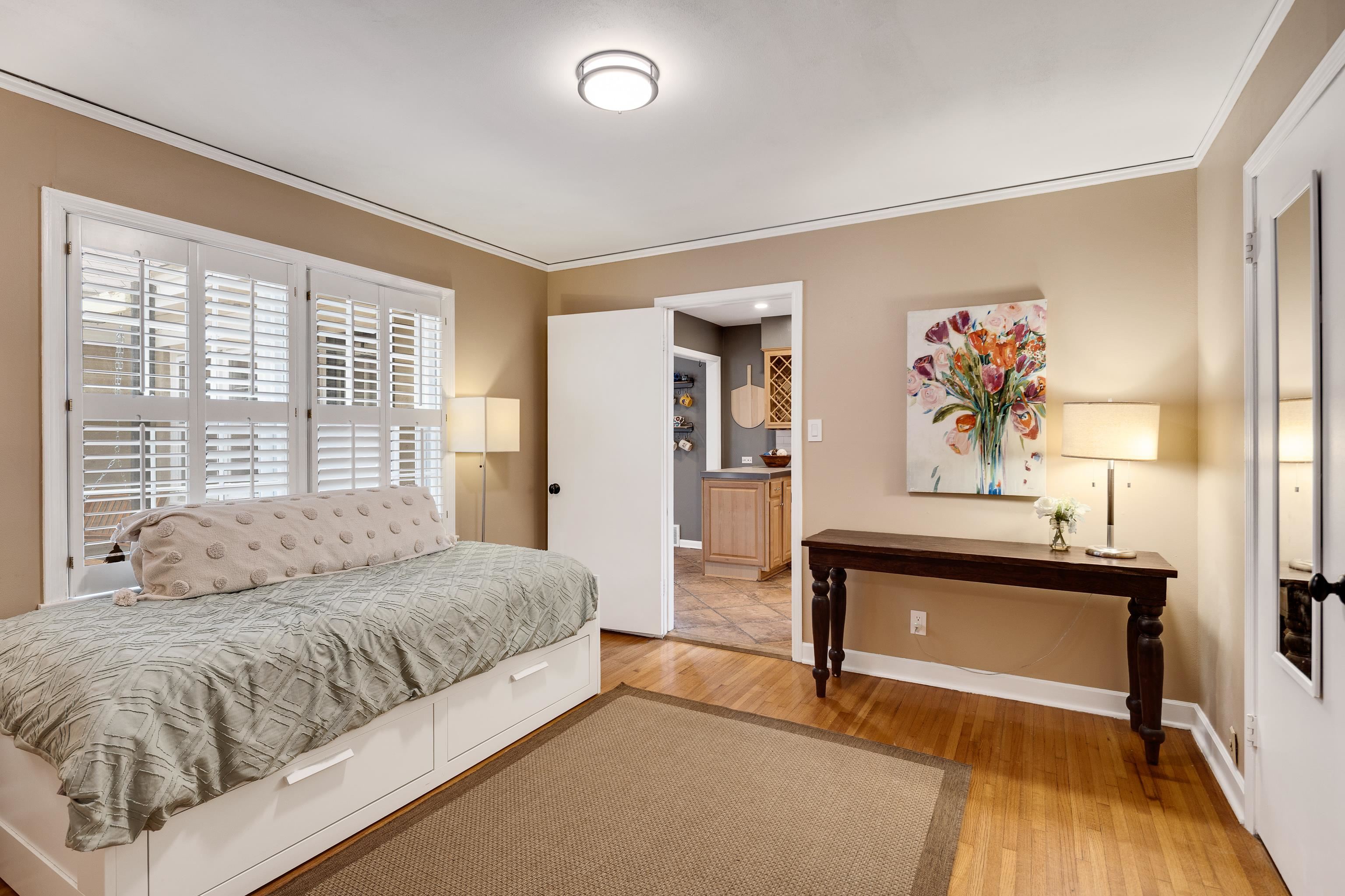 4474 Cherrydale Road Memphis, TN 38117 - Photo 19 of 35 a spacious bedroom with a bed and a table