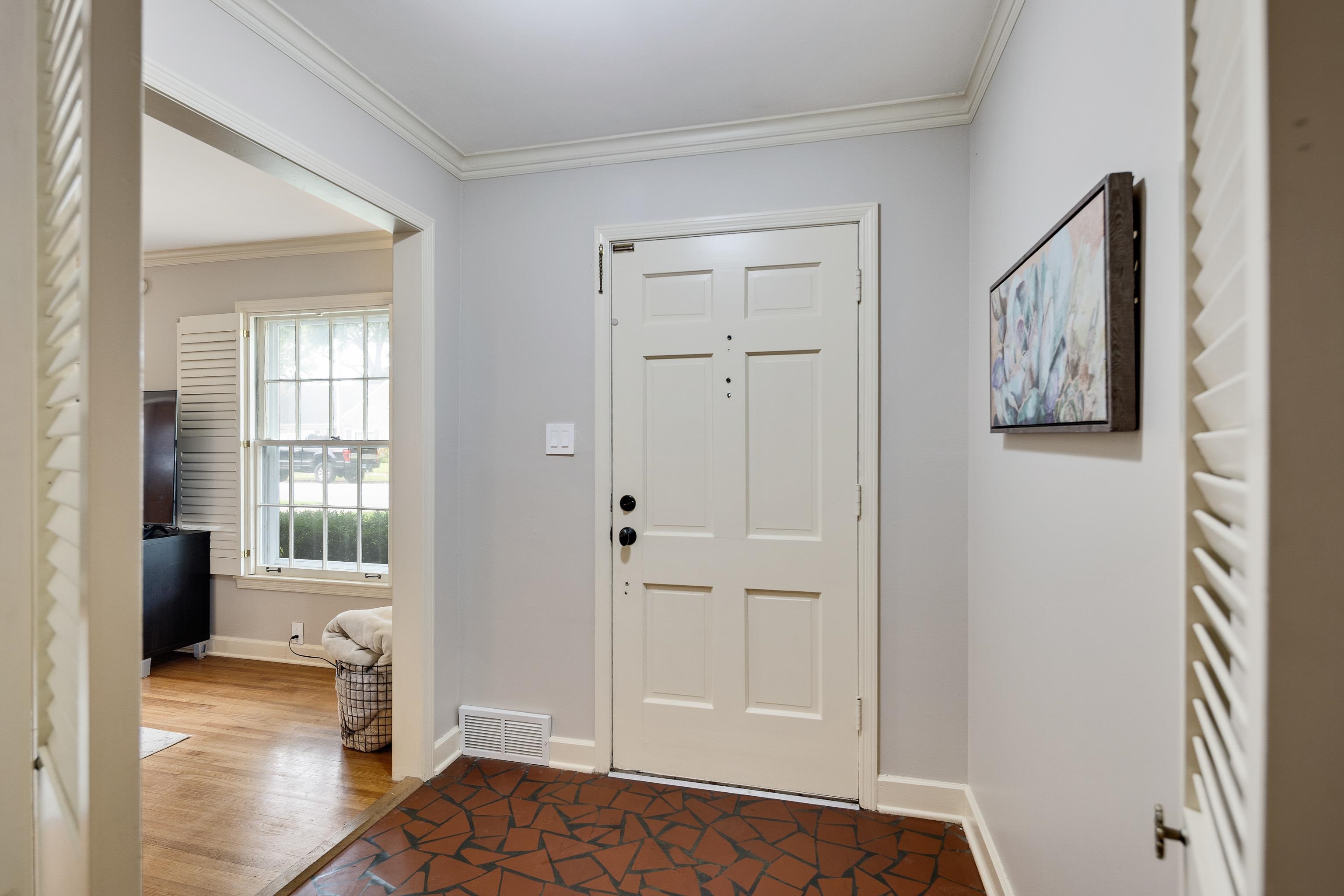4474 Cherrydale Road Memphis, TN 38117 - Photo 26 of 35 a view of a bedroom with wooden floor and windows