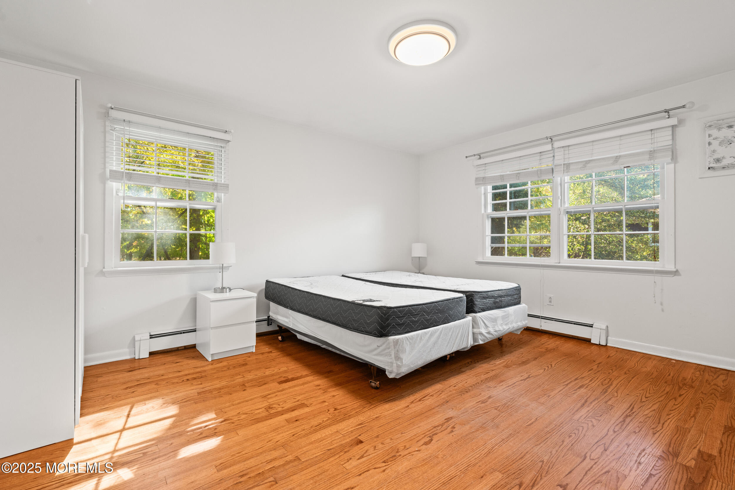 404 Brookside Avenue Oakhurst, NJ 07755 - Photo 15 of 43 a bedroom with a bed and window