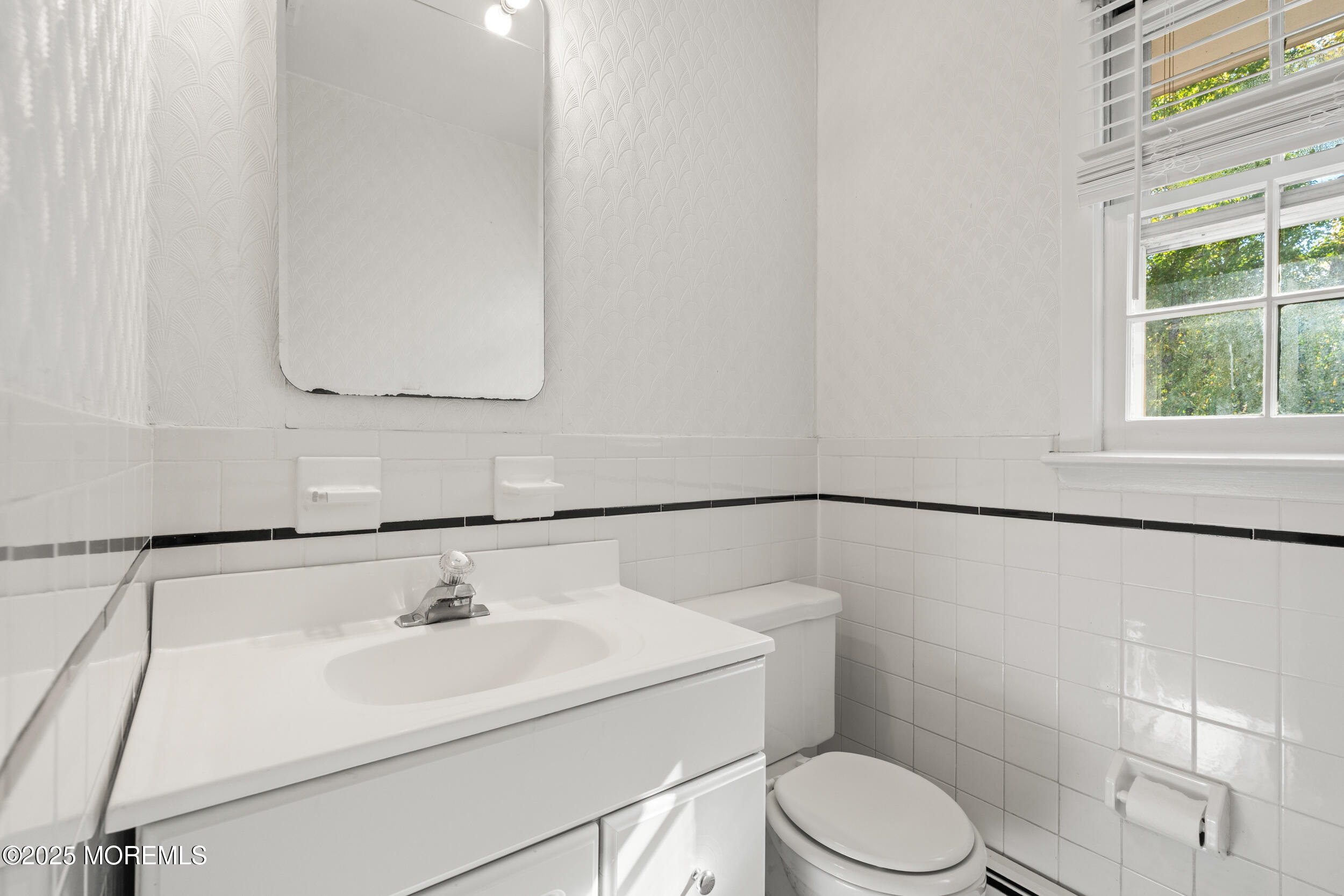 404 Brookside Avenue Oakhurst, NJ 07755 - Photo 25 of 43 a bathroom with a sink toilet and vanity