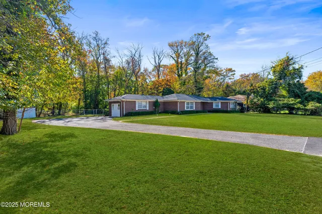 a view of a house with a big yard