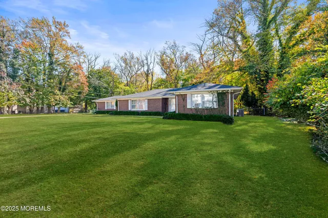 a view of a house with a big yard