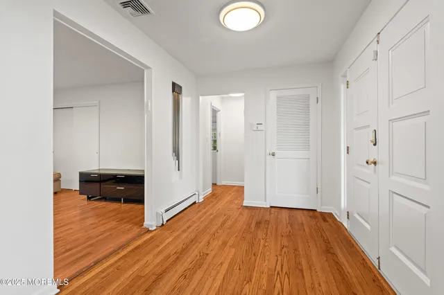 a view of a livingroom with wooden floor