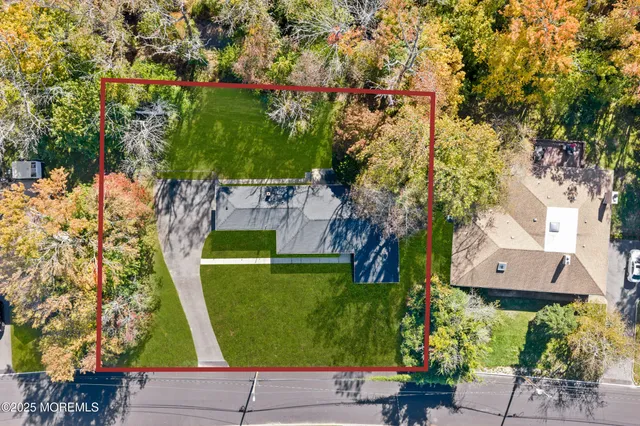 an aerial view of a house with a garden