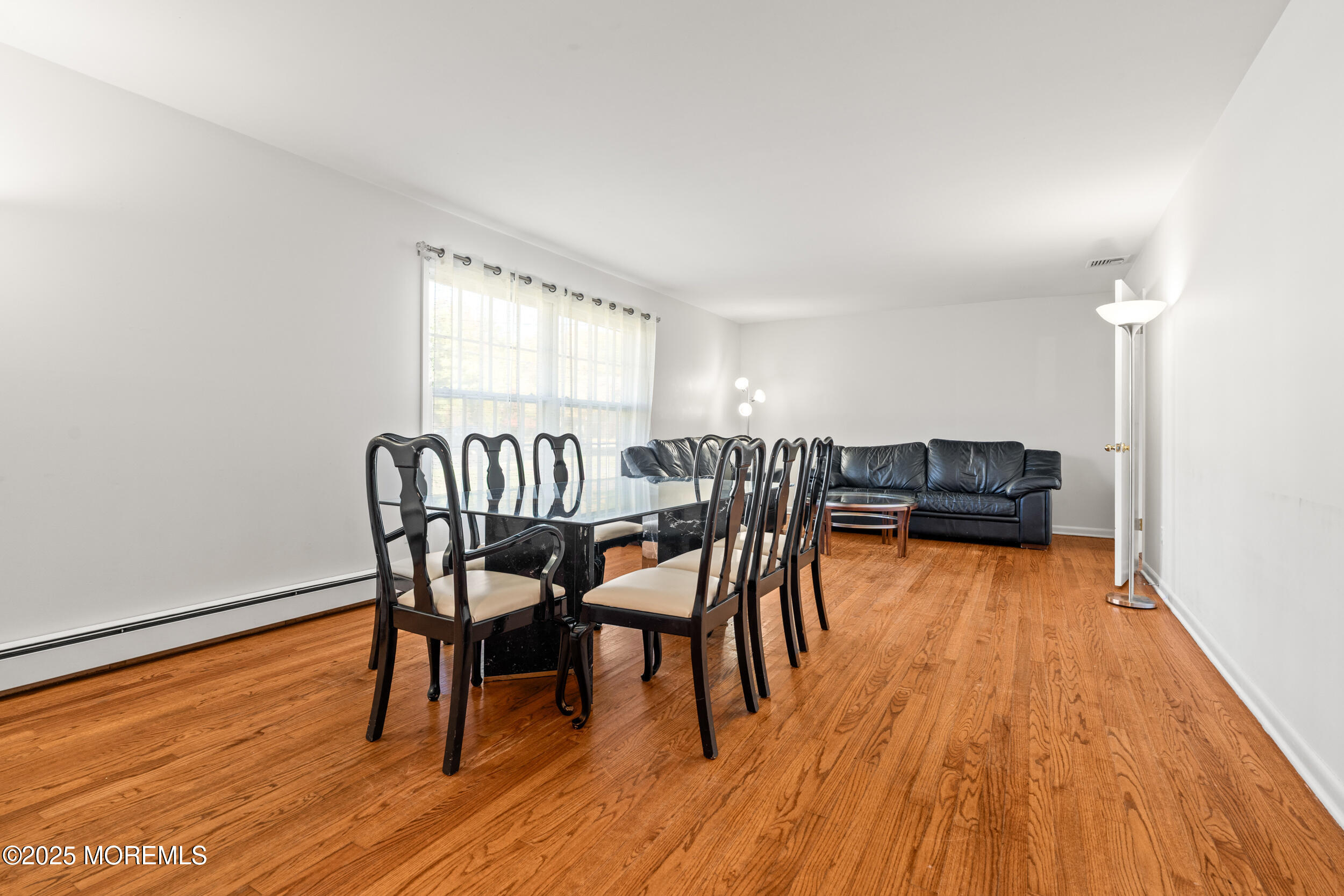 404 Brookside Avenue Oakhurst, NJ 07755 - Photo 5 of 43 a view of a dining room with furniture and wooden floor