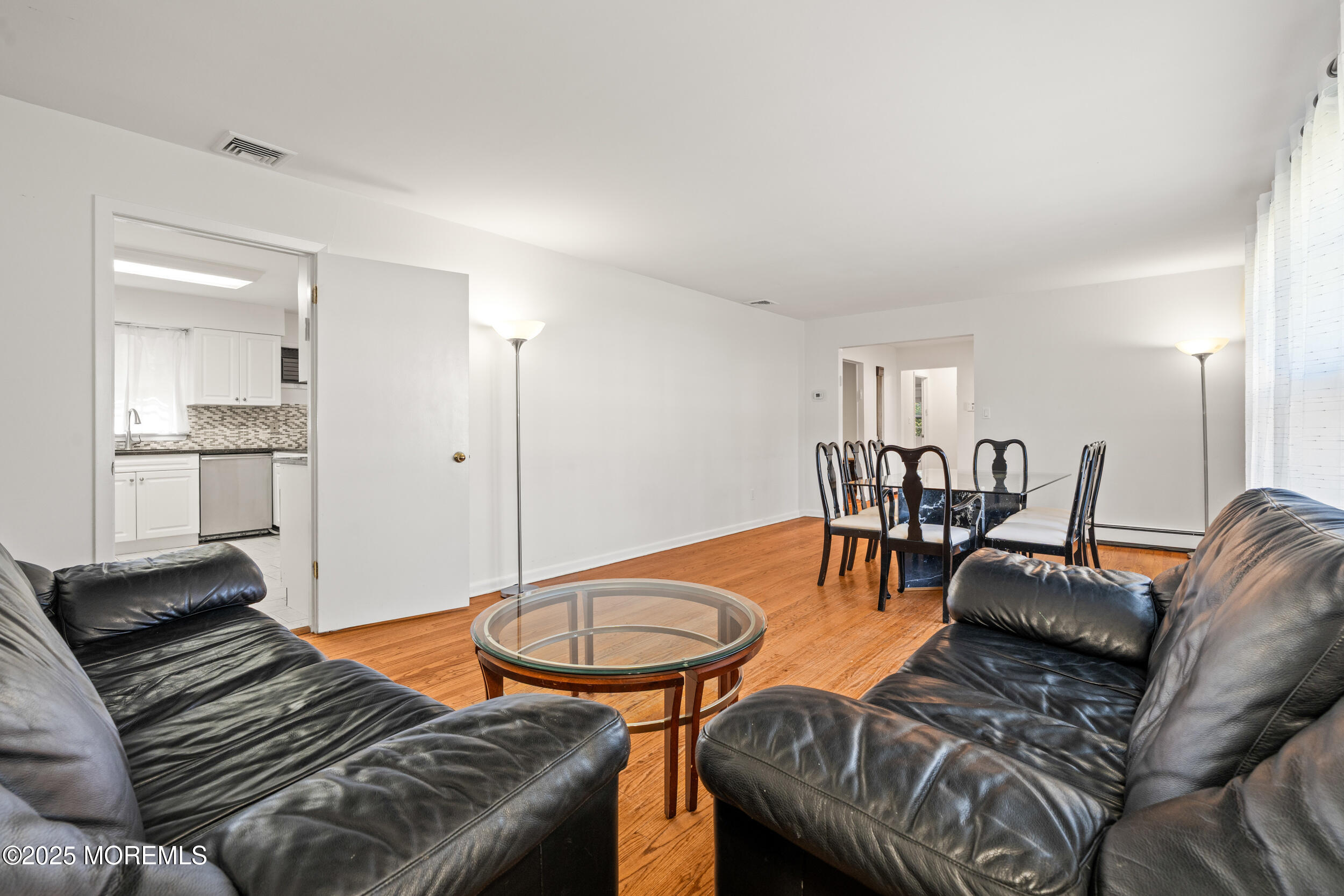 404 Brookside Avenue Oakhurst, NJ 07755 - Photo 8 of 43 a living room with furniture and kitchen view