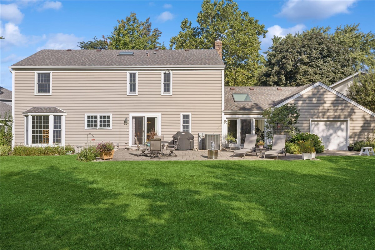 415 Hamilton Drive Wheaton, IL 60189 - Photo 22 of 27 a front view of house with yard and outdoor seating