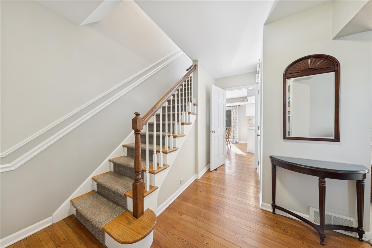415 Hamilton Drive Wheaton, IL 60189 - Photo 6 of 27 a view of entryway with wooden floor