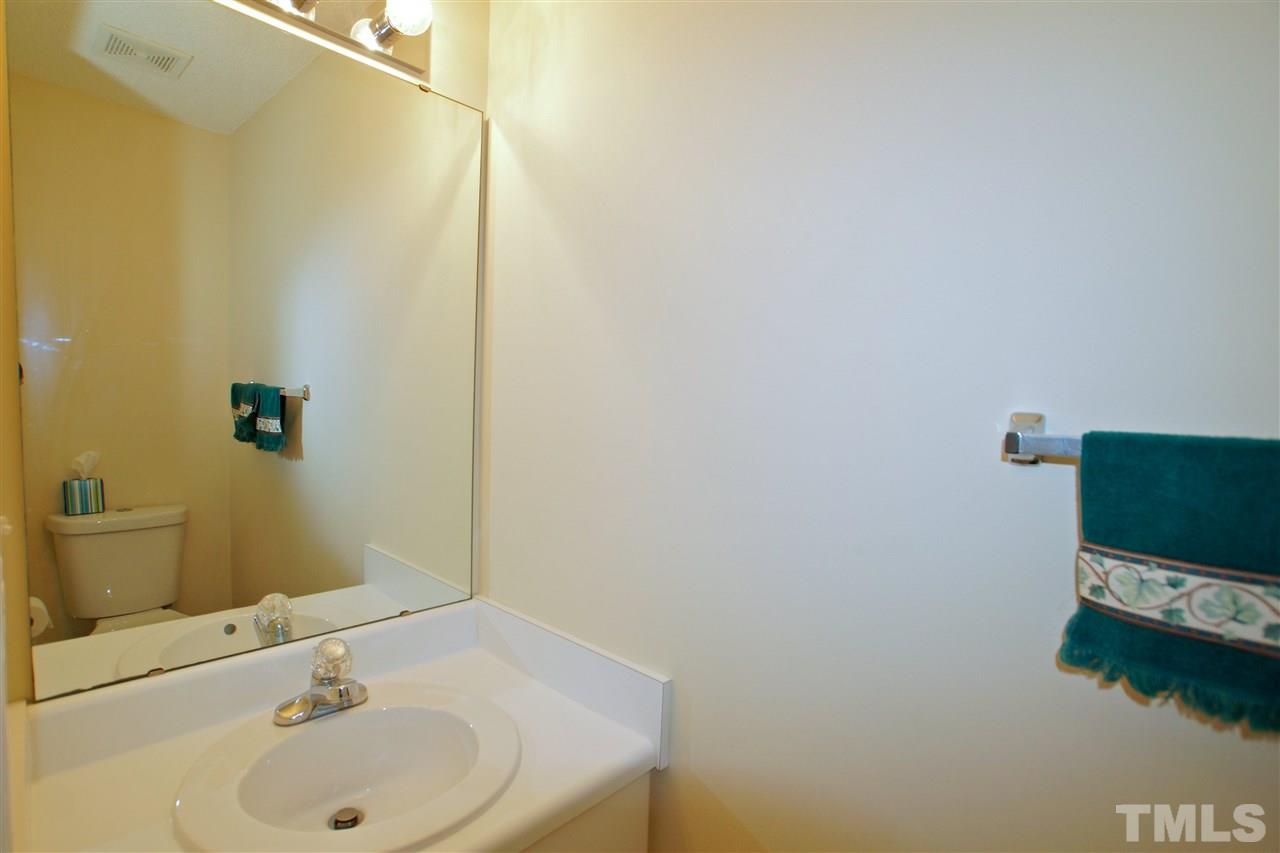 5106 Twisted Willow Way Raleigh, NC 27610 - Photo 12 of 22 a bathroom with a sink and a mirror