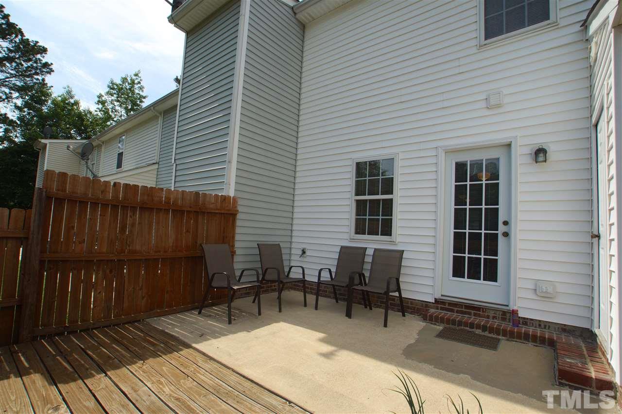 5106 Twisted Willow Way Raleigh, NC 27610 - Photo 21 of 22 a view of a house with wooden deck and furniture