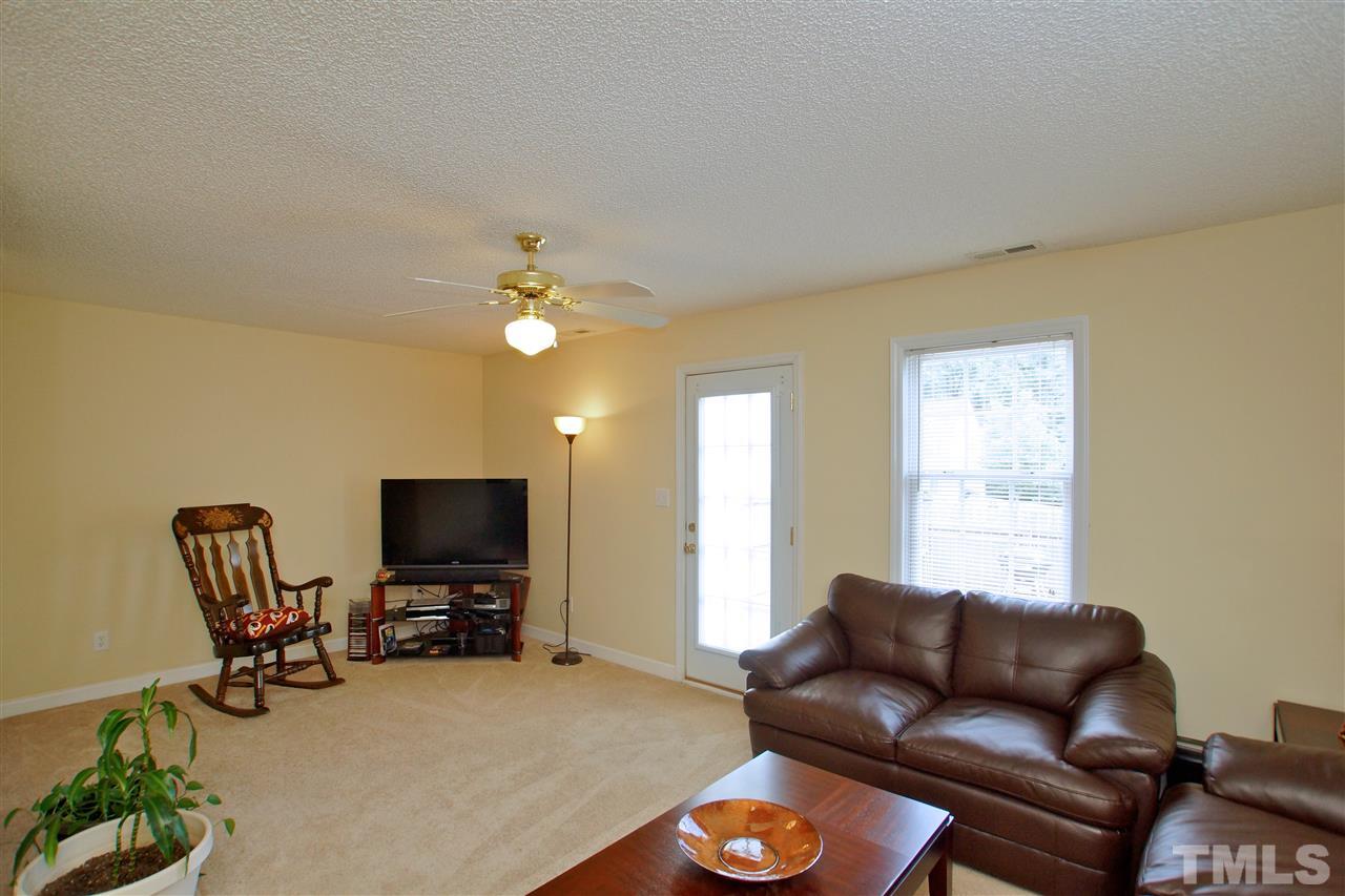 5106 Twisted Willow Way Raleigh, NC 27610 - Photo 8 of 22 a living room with furniture and a flat screen tv